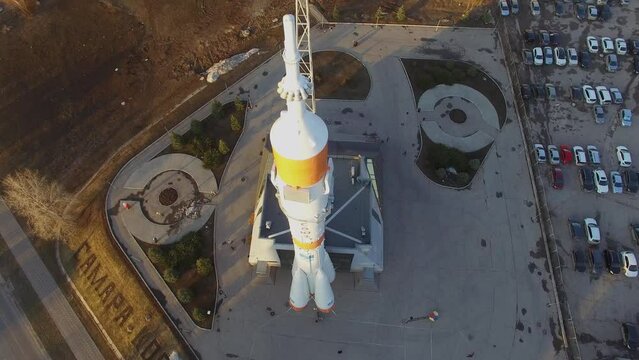 Souz rocket monument on square near road with traffic 