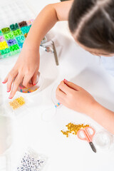 Obraz na płótnie Canvas Colorful Clay Beads Set for Creative Kids' Bracelet Making