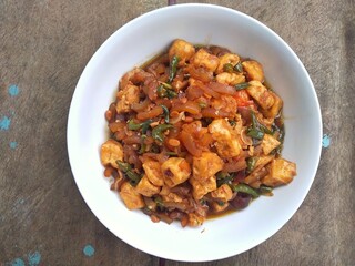 Kikil or cow skin with spicy flavors is minang cuisine of West Sumatra, Indonesia. Kikil Cooked using Indonesian herbs, such as red chilies, shallots, garlic, tomatoes, etc.