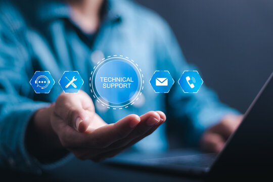 Technical support customer service concept, Businessman use laptop virtual screen of support customer icon for customer support center and contact us, call center and customer service help.