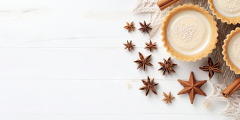 Tartlets with cinnamon and star anise on white wooden background. Top view, copy space Generative AI