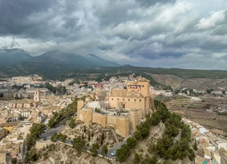Foto op Canvas Aerial view of Caravaca de la Cruz castle and medieval town in Southern Spain with stormy cloudy sky © tamas
