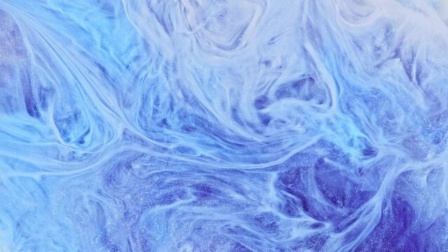 Fluid art footage with lilac, light blue and white overlapping colors. Liquid patterns are delicate, perfect for a tranquil and artistic backdrop. Abstract textures with sparkling sparkles.