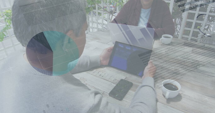 Statistical data processing against african american man using digital tablet