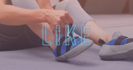 Neon blue like text banner against mid section of woman tying her shoelaces at the gym - Powered by Adobe