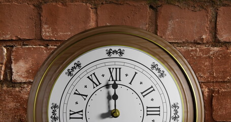 Image of clock ticking over brick wall background