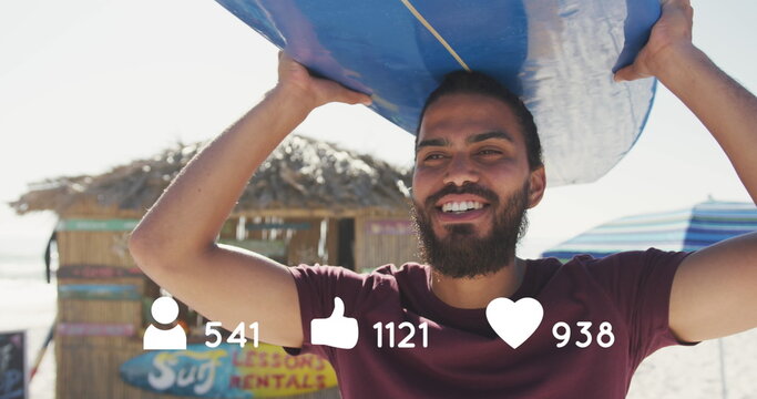 Image of people, thumbs up and heart icons with numbers over man with surfboard on beach