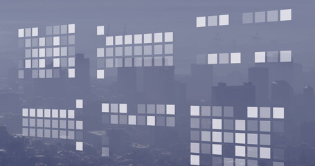 Image of geometrical shapes over cityscape