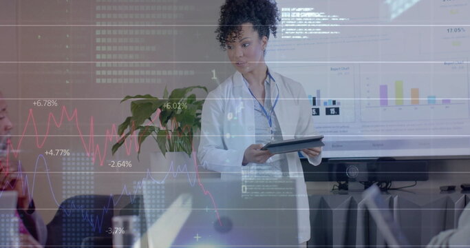 Image of data processing over biracial female doctor in office