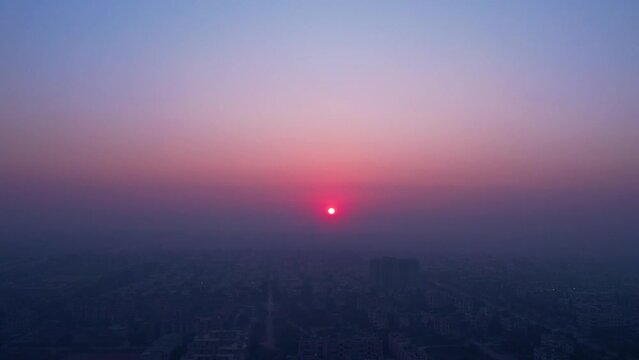 Smoggy sunset over city skyline - Environmental challenges in Pakistan