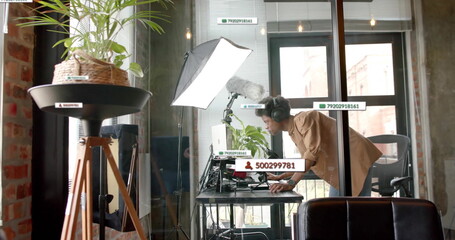 Image of data processing over african american businessman in office