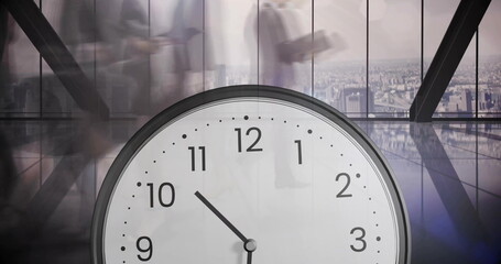 Image of clock over diverse business people walking