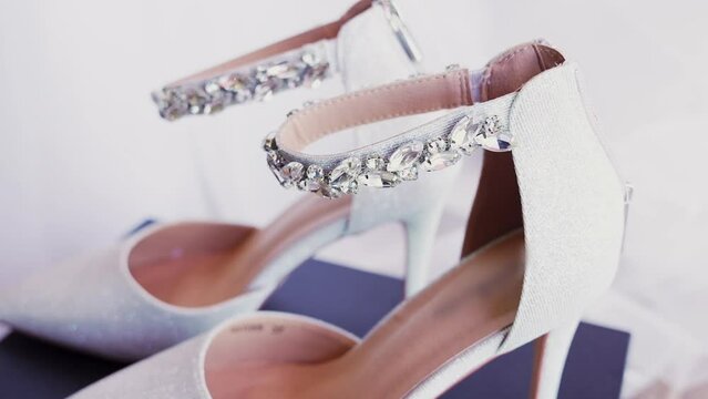 Close up shot and side view of a bridal high heel shoes