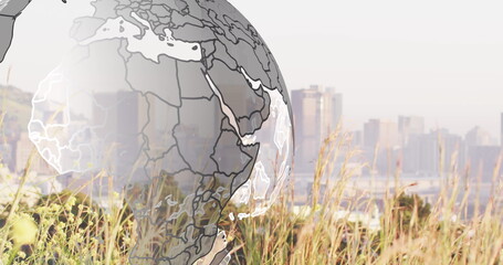 Image of globe over cityscape