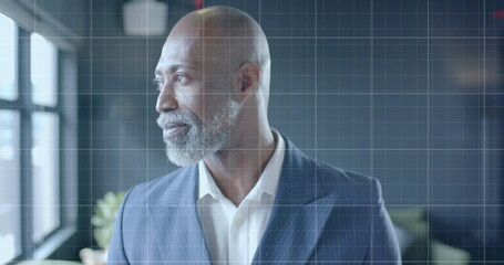 Image of financial data processing over african american businessman in office