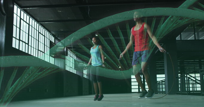 Image of dna strain spinning over man and woman woman jumping rope - Powered by Adobe