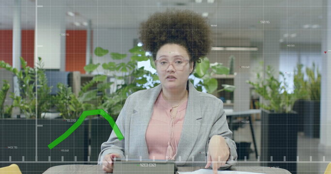 Image of financial data processing over biracial businesswoman in office