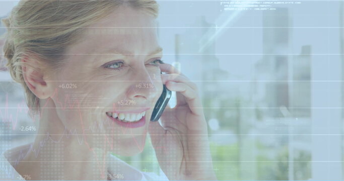 Image of data processing over caucasian woman using smartphone - Powered by Adobe