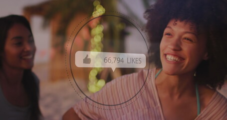 Like icons with increasing numbers against african american woman smiling at the beach