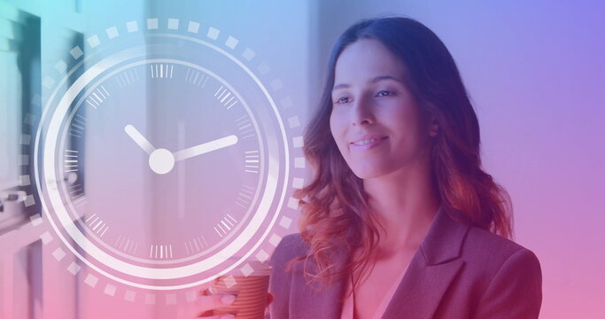 Image of clock over caucasian businesswoman in office