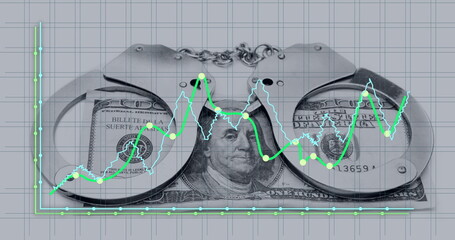 Image of financial data processing over american dollar bill and handcuffs
