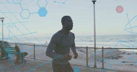 Medical data processing against african american fit man running on the promenade