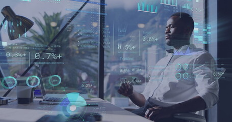 Image of data processing over african american businessman in office