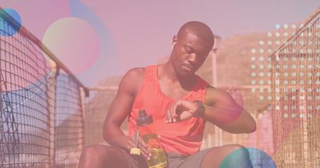 Image of shapes over african american man drinking water outdoors