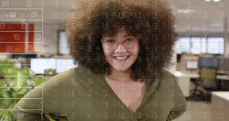 Image of statistics and data processing over biracial woman in office