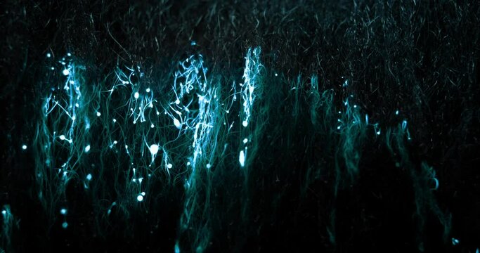 A wave of blue glowing electrical energy rises from the bottom to the top, throwing around sparks and leaving behind blobs of burnt material