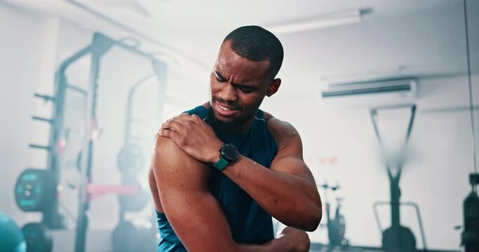 Gym, shoulder pain and black man with fitness, injury and inflammation with workout and burnout. Accident, African person and athlete with arthritis and muscle tension with exercise and fibromyalgia