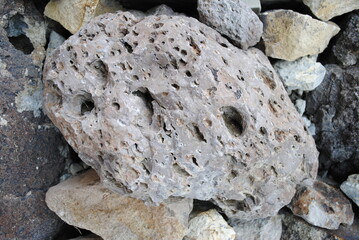 Volcanic Breccia rock with holes,  air pockets. Close up macro shot of igneous volcanic rock.