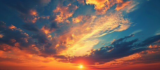 Fototapeta premium Marvelous Cloudy Sky Sunset Background - A Breathtaking Blend of Cloudy Sky, Sunset, and Background Creates a Captivating Image