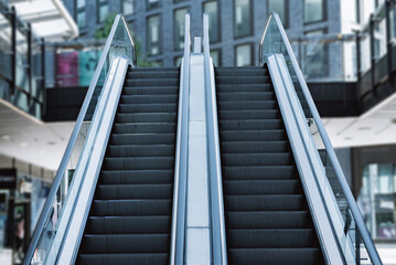 The escalator with modern buildings in modern office building.