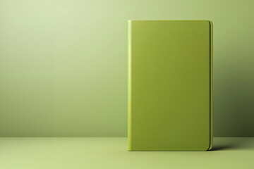 A green blank book cover sitting on top of a green background.