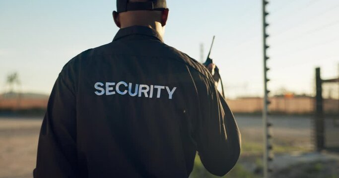 Security guard, radio and man on patrol outdoor for inspection, investigation and property search. Surveillance, law and person with walkie talkie for safety, communication and protection service
