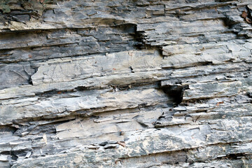 Stone wall with different stones. Texture, various natural stones