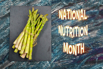 Celebrating National Nutrition Month With Fresh Asparagus on a Slate Background