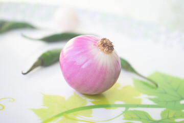 An onion also known as the bulb onion or common onion, is a vegetable that is the most widely cultivated species of the genus Allium.