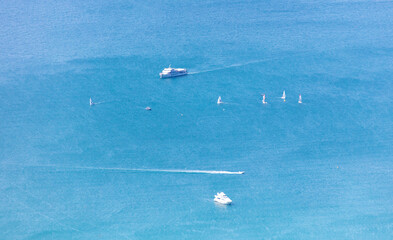 Boats float in the sea, top view