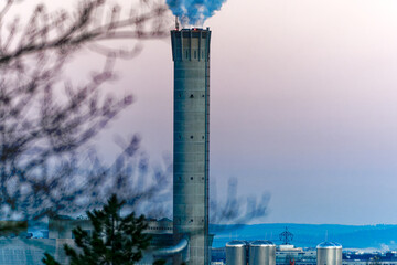 View over Swiss City of Zürich with skyline and chimney with smoke of incineration plant on a sunny winter morning. Photo taken January 27th, 2024, Zurich, Switzerland.