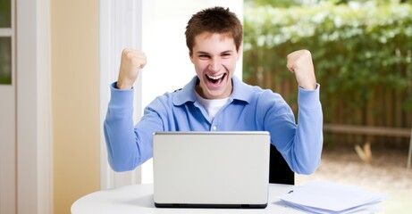 a man cheers in front of a laptop