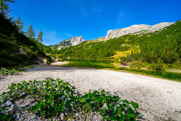 Steirersee on the high plateau of the Tauplitzalm. View of the lake at the Totes Gebirge in Styria. Idyllic landscape with mountains and a lake on the Tauplitz in Austria.