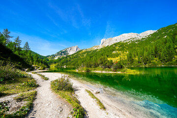Steirersee on the high plateau of the Tauplitzalm. View of the lake at the Toten Gebirge in Styria. Idyllic landscape with mountains and a lake on the Tauplitz in Austria.
