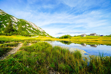 Tauplitzsee on the high plateau of the Tauplitzalm. View of the lake at the Totes Gebirge in Styria. Idyllic landscape by the lake on the Tauplitz in Austria.
