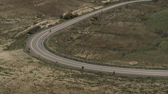 Aerial view of a lone motorcycle rider on the road