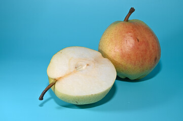 two juicy pears on a green background, studio shooting 9