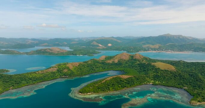 Drone view of Island with turquoise water and coral reefs. Lajala, Coron. Palawan. Philippines.