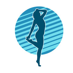 Silhouette of a slim female in dance pose. Silhouette of a woman dancing.