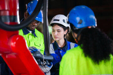 Technical of robot operation department. Engineer worker use tablet control robotic automatic, Factory Industry automatic system software.